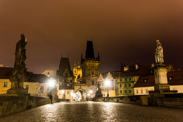 Charles bridge in Prague with lanterns at night