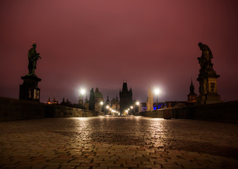 Obraz premium Charles bridge in Prague with lanterns at night