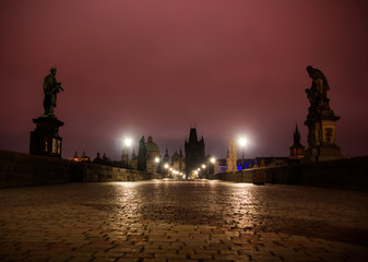 Charles bridge in Prague with lanterns at night