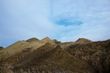 multicolored hills of the quarry for the extraction of manganese ore