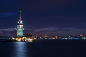 Naklejka premium golden clocks and a girl tower.maiden's tower