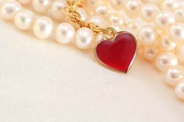 Red heart on silk with pearls necklace