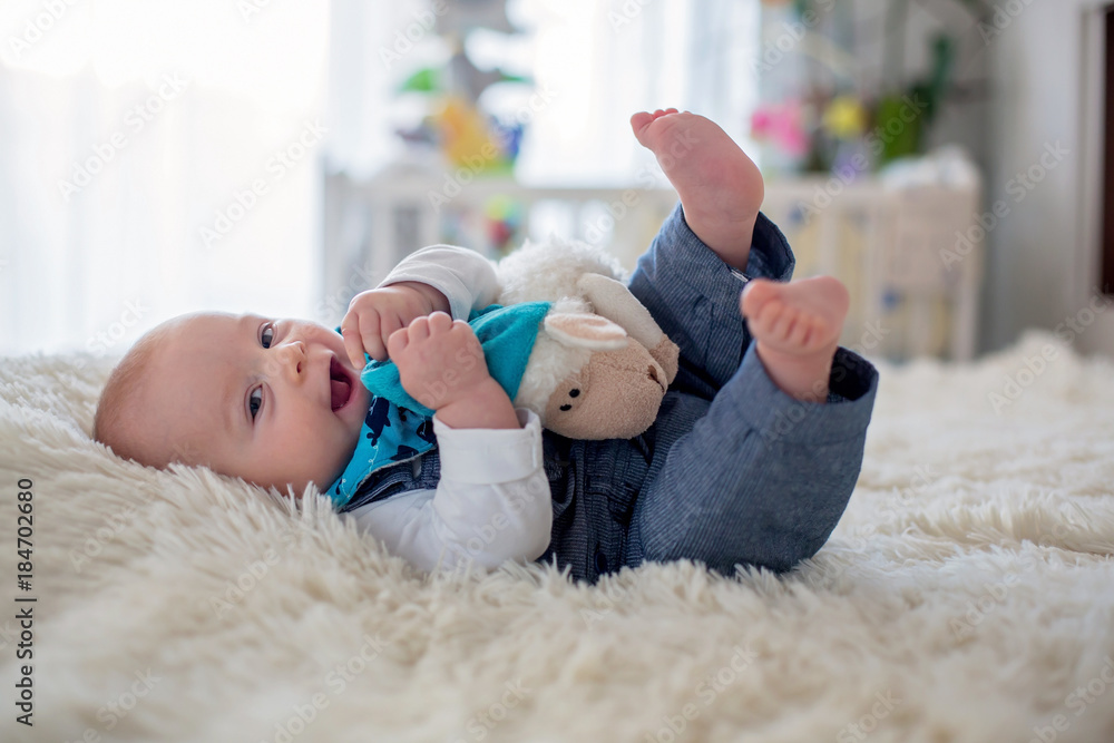 Canvas Prints Little cute baby boy, playing with toys at home