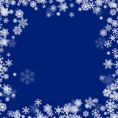 Christmas snow background with scattered snowflakes falling in winter
