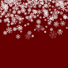 Christmas snow background with scattered snowflakes falling in winter