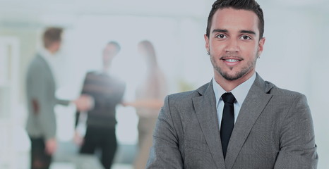Happy mature business man looking at camera with satisfaction at office