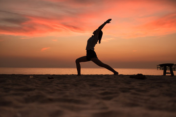 Yoga in the sunset beach