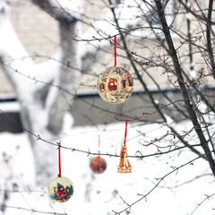 New Year card. New Year's toy. Toy on a Christmas tree in the snow. New Year