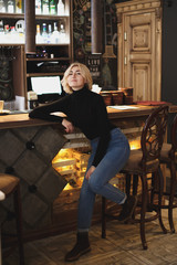 Beautiful woman bartender in the bar