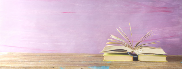 opened book on grungy background, panoramic, good copy space