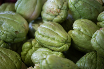 Fresh vegetables Chayote. Chuchu in the Indian market in Mauritius.