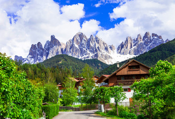 Fototapeta na wymiar Alpine scenery - Dolomites mountains and traditional villages. Val di Funes, Italy