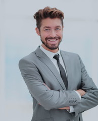 Close up portrait of a smiling handsome business man  over white