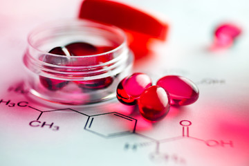 Painkiller tablets - pink caps with molecules chemical formulas - healthcare and medicine