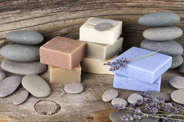 Assorted natural soap bars and pebbles
