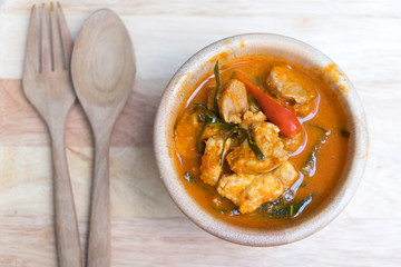 Panaeng Curry with pork on wooden bowl