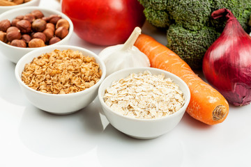 Fresh raw vegetables with nuts and cereals for cooking or eating. Vegetarian food.