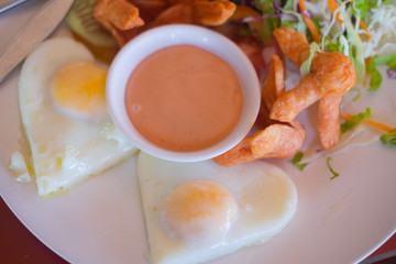 Breakfast with over easy egg  and hotdog