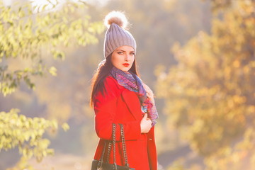  Woman, red coat, gray hat, serious, handbag