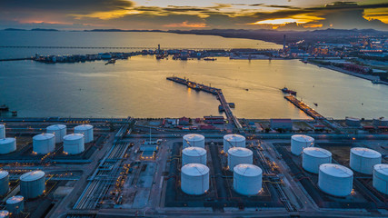 Aerial view oil terminal construction with industrial crane port facility for storage oil and petrol chemical ready for transport to harbor further storage, Cargo industry port ship. - obrazy, fototapety, plakaty