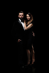 fashion studio photo of beautiful couple in elegant clothes