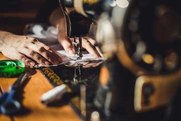 sewing machine and woman's hands