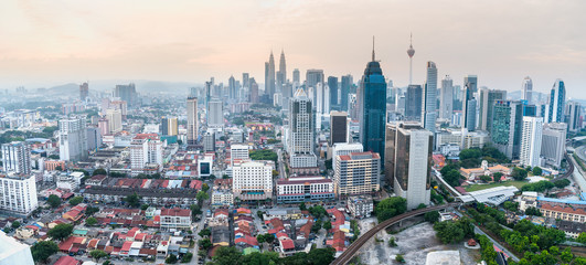 Panorama cityscape of Kuala Lumpur skyscraper with colorful sunrise sky, Malaysia.