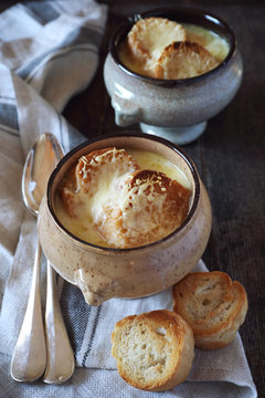 French onions soup with baguette, rustic style