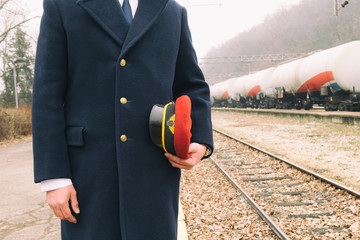 Train driver standing on the train station.