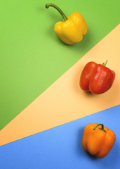 Colorful bell peppers on a colorful background. Flat lay. The view from the top.