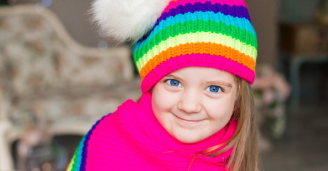 Girl,  rainbow hat and scarf, close up