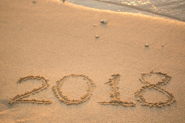 The inscription on the sand in 2018, which washes off a wave.