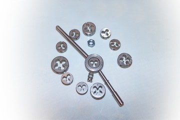 Tool for threading in holes and stilettos on a white background
