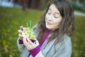 funny girl eating donuts in the park