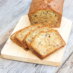 Sliced Banana cake on wood plate. Healthy dessert. Sweet and moist taste. Dessert of mixed with fruit and bakery.