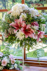 Wedding floral decorations with roses, lillies, dahlias and carnations.