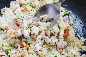 Rice with vegetables and chicken.