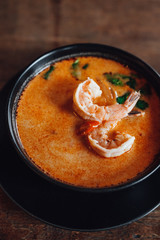Tom Yam - is a type of hot and sour Thai soup, usually cooked with shrimp (prawn). Tom yum has its origin in Thailand. In recent years, tom yam has been popularised around the world.