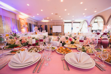 Luxury decorated with flowers and a festive Banquet hall restaurant in pink.