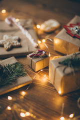 Wrapped vintage Christmas presents on wooden background 
