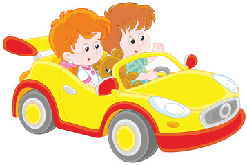 Little children playing in a toy sports car