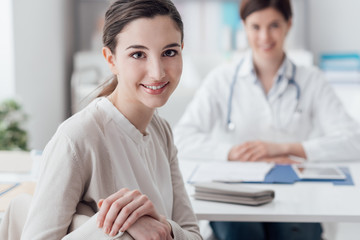 Smiling patient in the GP's office