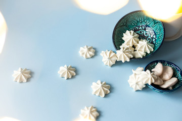 Dessert with meringue, a lot of white meringues on table