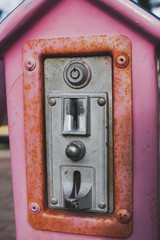 Coin slot machine on a toy of child park.