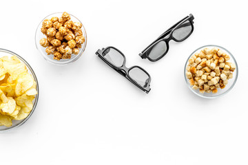 Fast food for watching film. Crisps, popcorn, rusks near glasses on white background top view copyspace