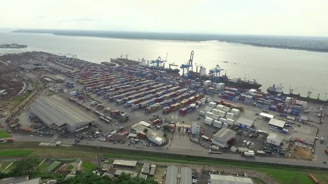 Wide aerial, crates in Douala port