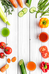 Wellness elements. Colorful detox drinks with vegetables  on white wooden background top view copyspace