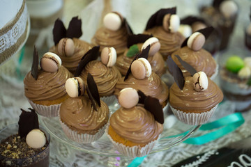 Wedding cake with cupcakes at the exhibition