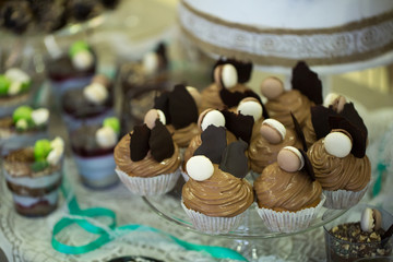 Wedding cake with cupcakes at the exhibition