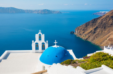 Fototapeta na wymiar Blue domed church Santorini Island in Greece